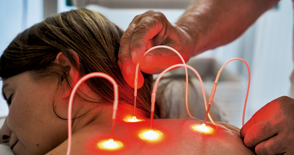 Non-invasive laser therapy applied to a woman's back